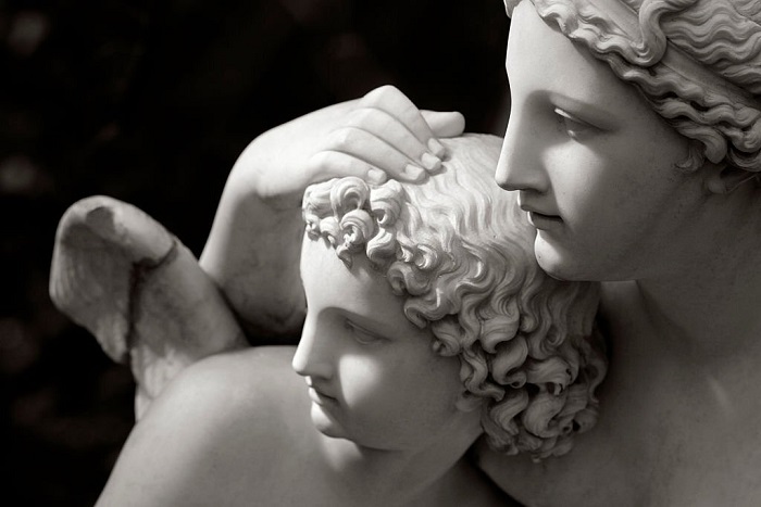  Two angel statues, mother and child, shot  in a public park in Cologne.