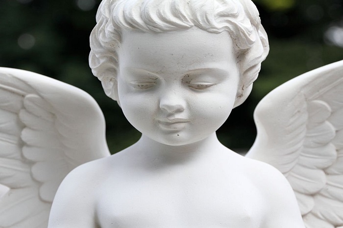 Detail of beautiful cemetery angel statue
