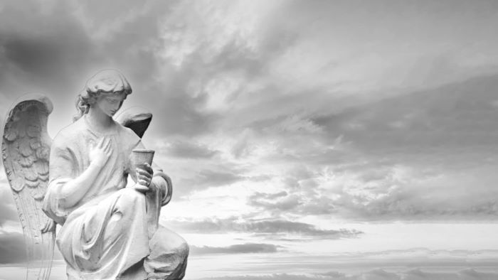 White stone guardian wing angel on sky background