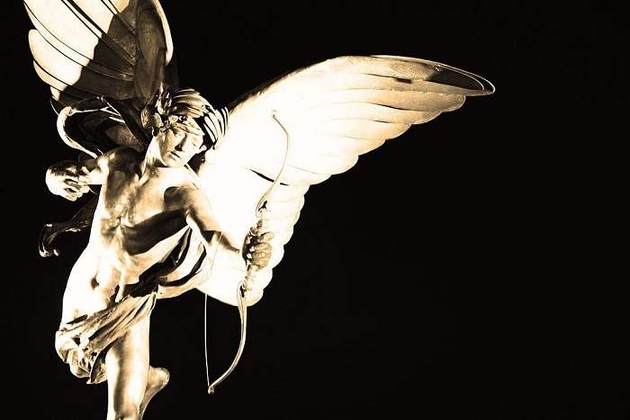  The famous Eros statue in the centre of Piccadilly Circus is illuminated to create a stark contrast against the night sky