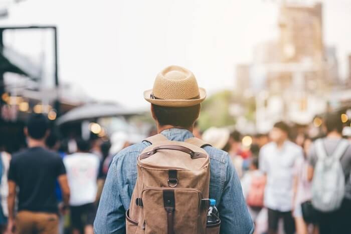 Lorenzo traveling backpacker walking street market