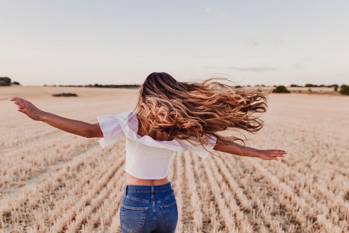 Mia enjoying nature on yellow field