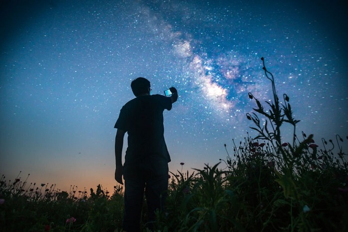  Preston using his phone to capture the view of the sky