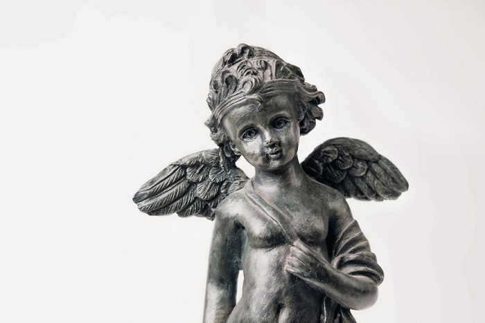 Partial body of metal boy with wings 