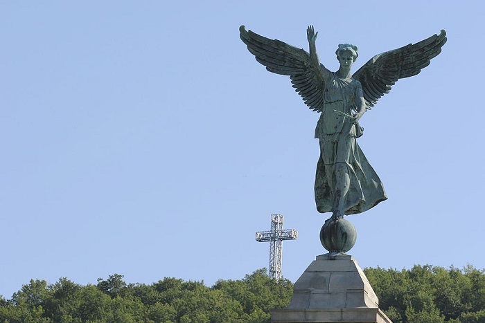 Angel statue and Cross on the Mount-Royal in Montreal