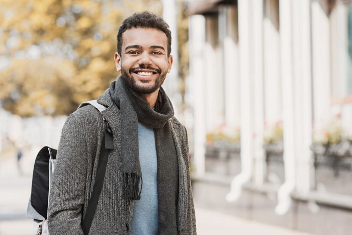 Joyful smiling men in a city